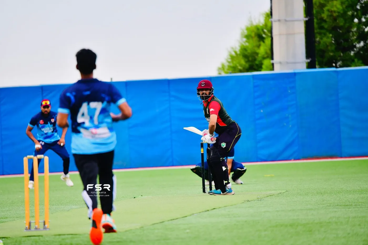 UK Bangla Tigers match action with bowler delivering and batters at the crease