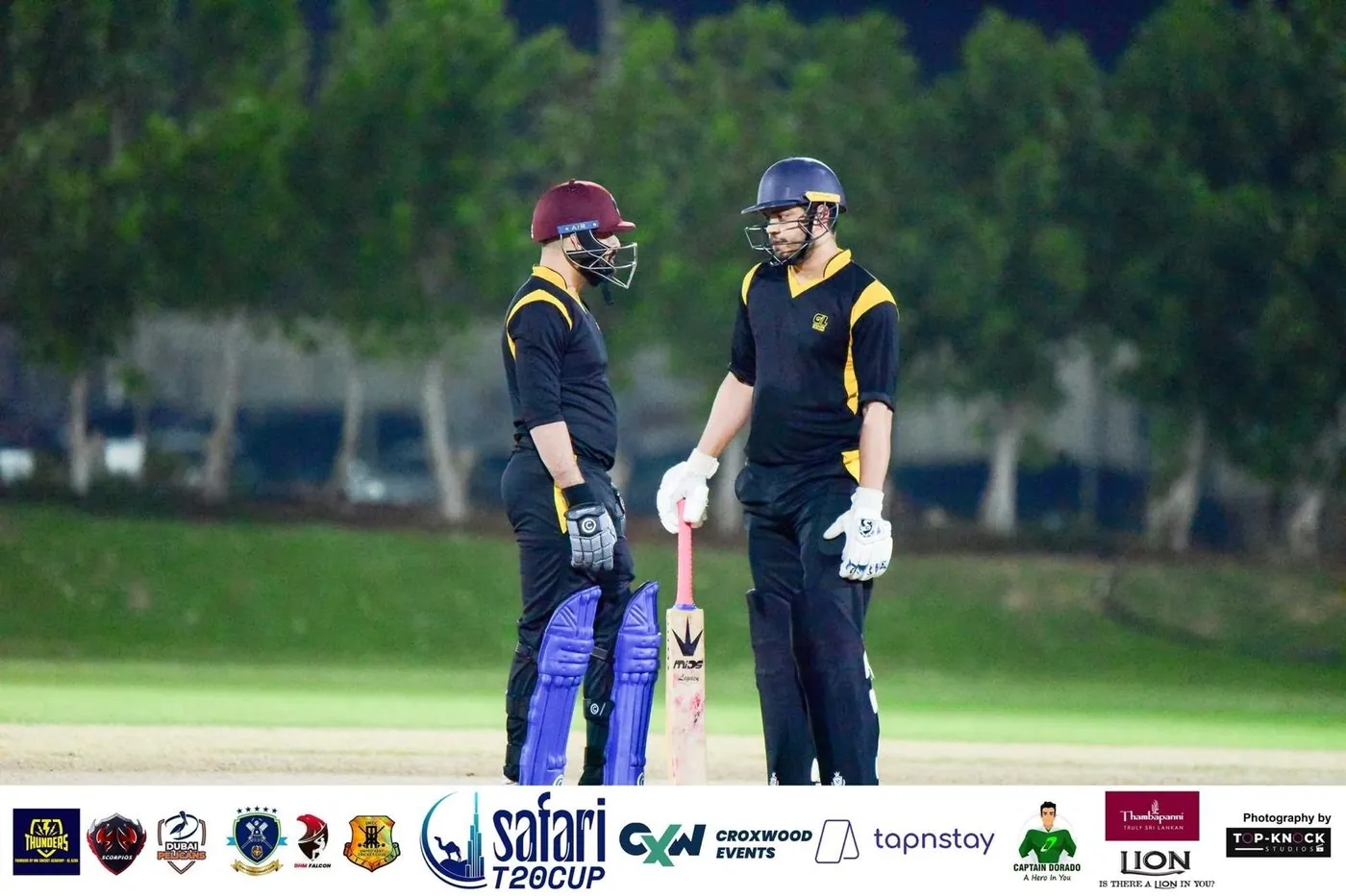 UK Bangla Tigers batters together at the crease during a match